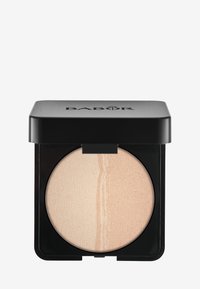 Jauhemaalari pyöreässä kompaktissa, jossa on kaksivärinen kerma- ja beige-sävy sekä sileä rakenne. Musta neliöpakkaus logolla.