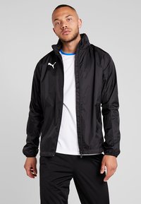 Puma LIGA RAIN CORE Hardshell jacket black/white/black Zalando