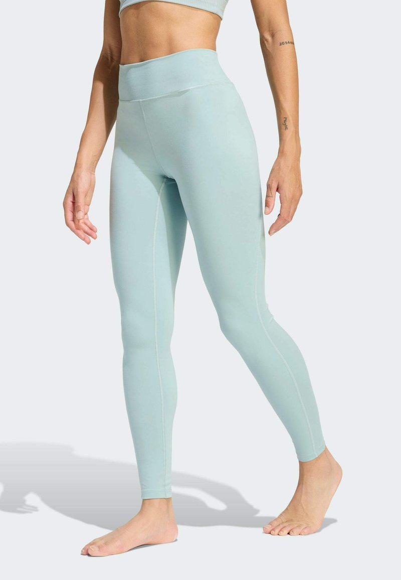 Hochtaillierte Leggings in hellmintgrün, mit einer glatten Textur, enganliegendem Design und kontrastierenden Seitennähten.