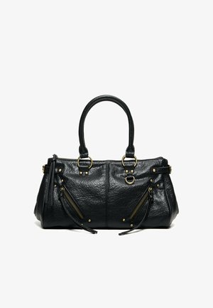 Sac à main en cuir noir avec deux anses, deux poches zippées inclinées avec des pompons, et des anneaux et clous en métal doré.