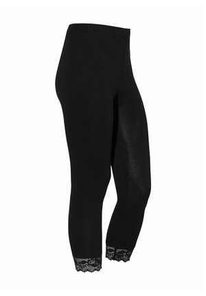 Zwarte aansluitende cropped leggings met kanten rand aan de zoom, getoond op een paspop tegen een witte achtergrond.