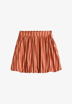 Īsa pleita svārku svārki rūsas krāsā ar mainīgām bālganām apelsīnu vertikālām svītrām. Iespējas plaša jostasvērta un plūstoša silueta.