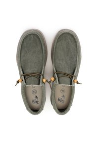 Green suede shoes with a rounded shape, elastic laces, wooden accents, and a textured outer sole. Flat design with minimal stitching details.