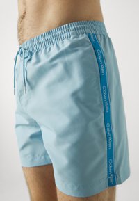 Calvin Klein Swimwear DRAWSTRING - Swimming shorts - pleasant blue