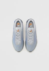 Blue and gray athletic shoes with mesh upper, round toe, and flat laces. Features Nike branding and Air Max logo on the insole.