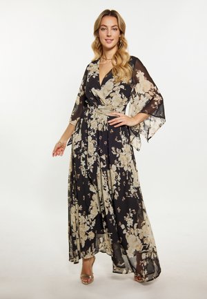 Rochie înflorată, din material negru transparent, cu flori mari în nuanțe de crem și auriu. Prezintă mâneci largi și talie cu curea, curgând până la glezne.