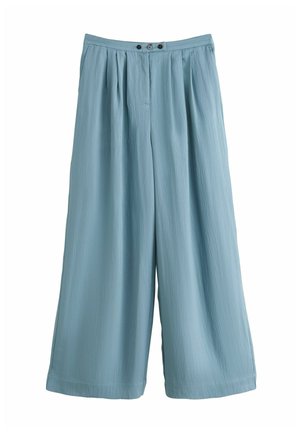 - Spodnie materiałowe