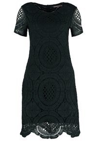 Robe noire à manches courtes, longueur aux genoux, avec des motifs en dentelle circulaires complexes et un ourlet festonné.