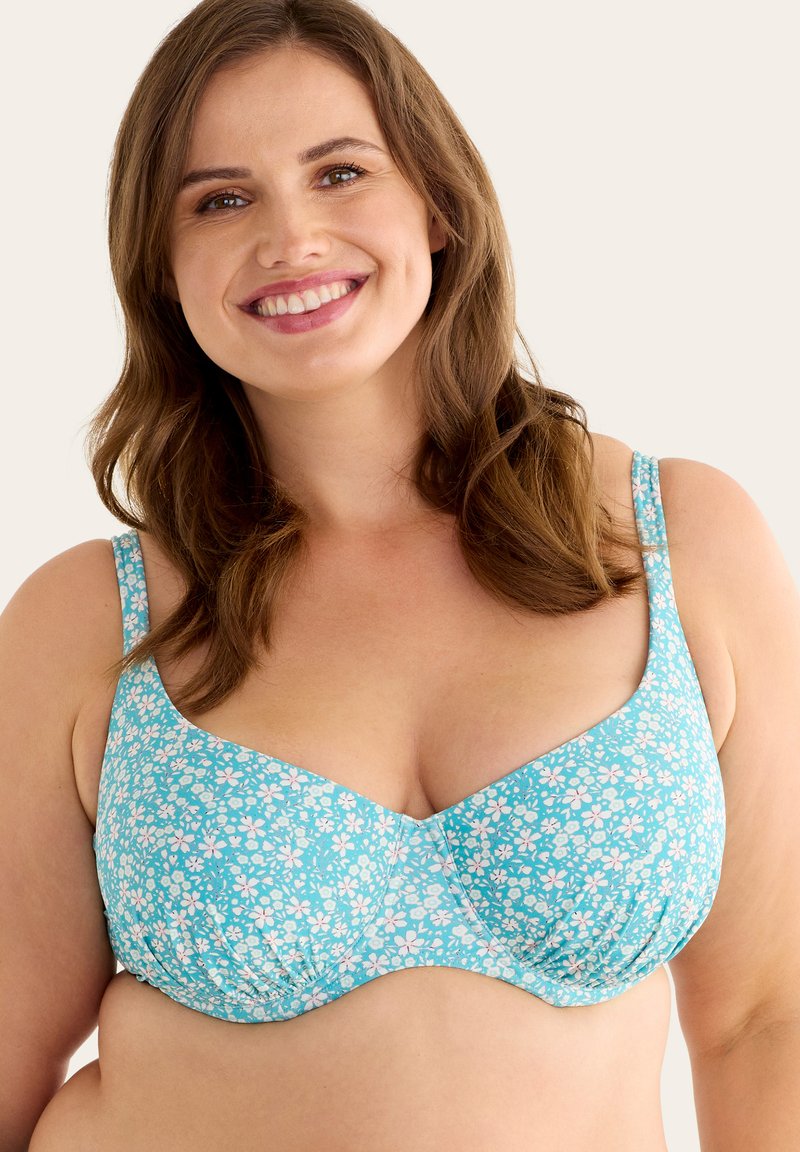 Ljusblå bh med blommönster, med tunna justerbara band och en mjuk yta. Designad med byglar för stöd.