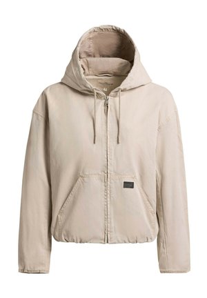 Beige zip-up hooded jacket with drawstrings and front pockets, gathered hem, and a small black label on the pocket.
