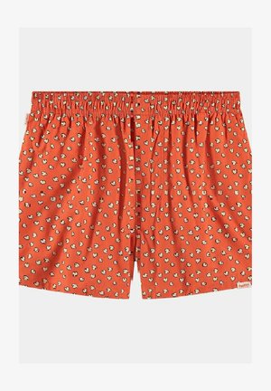 Boxers rouges avec un imprimé de pop-corn, dotés d'une taille élastique et d'une coupe décontractée. Fabriqués en tissu doux pour plus de confort.