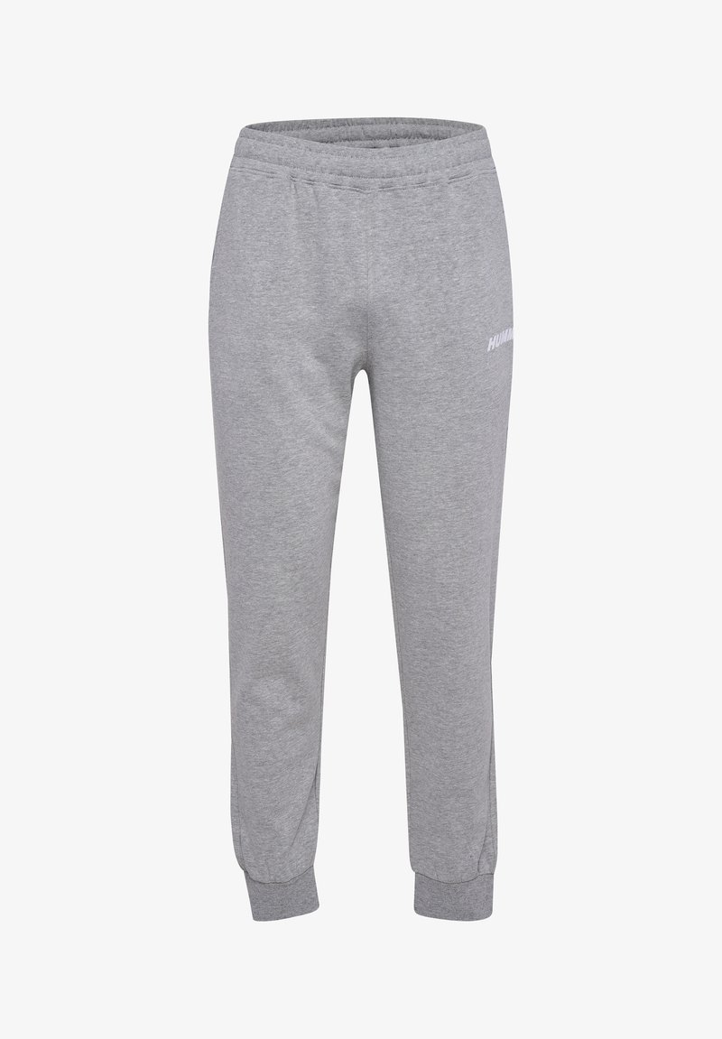 Grijze sweatpants van zacht materiaal, met een elastische tailleband, taps toelopende boorden en een klein gedrukt logo aan de zijkant.