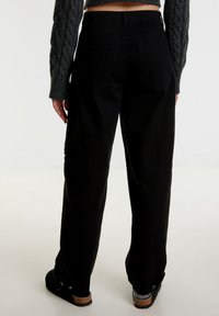 EDITED Relaxed fit -farkut - black