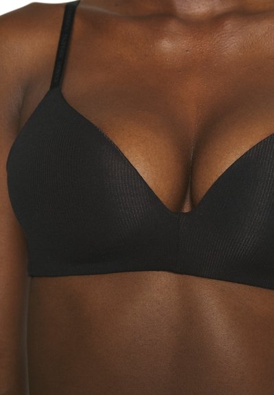 Black ribbed triangle bralette with thin straps, featuring a deep V-neck and seamless design, offering a smooth texture and minimalistic look.