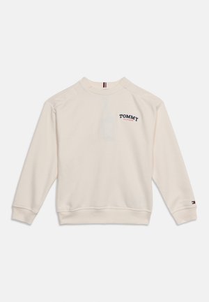 Krémová mikina s dlhým rukávom s logom "Tommy Hilfiger" na hrudi a malým emblémom vlajky na ľavom zápästí.