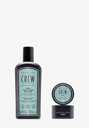 Flacon de 250 ml de American Crew Fiber Pre-Styling Cleanser à côté du produit de coiffage American Crew Fiber dans un récipient rond.