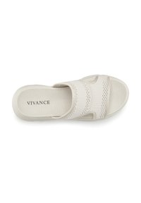 Light beige slide sandal made of smooth fabric with a textured sole, featuring woven accents and an open-toe design.