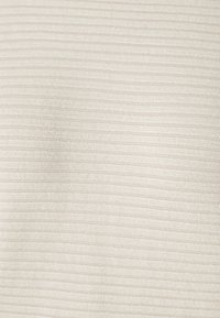 Textured fabric in light beige with horizontal stripes. Material appears soft with a subtle sheen and consistent pattern throughout.