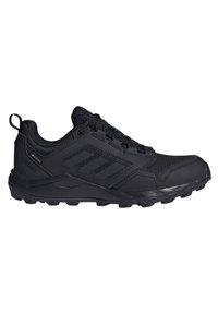 Scarpe da ginnastica nere con una tomaia in rete testurizzata, dettagli rinforzati, un collare imbottito e una suola in gomma resistente per una migliore trazione.