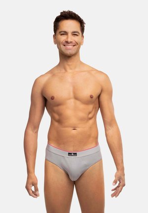 Graue Herrenunterhosen mit einem weichen, elastischen Bund, der mit einem pinken Akzent versehen ist. Hergestellt aus einem glatten, dehnbaren Stoff für Komfort und Passform.