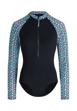 Maillot de bain noir à manches longues avec fermeture éclair frontale, imprimé floral sur les manches et le col dans des tons violets, bleus et verts.