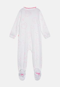 Body bianco a coste con motivi a cuore rosa, maniche lunghe, colletto rosa con ruffles e scritte rosa sulla pianta dei piedi.
