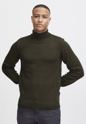 Pulover cu guler înalt de culoare verde închis, realizat dintr-un material tricotat texturat, având o siluetă ajustată și mânici și tiv de tip dantelat.