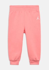 Ροζ βαμβακερό παντελόνι jogger με ελαστική μέση και μανσέτες, με λευκό λογότυπο Jordan στο αριστερό μηρό.