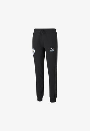 Schwarze Puma Jogginghose mit Manchester City Logo am linken Oberschenkel und Puma Logo am rechten Oberschenkel, elastische Bündchen und Kordelzug in der Taille.
