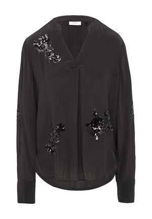 Blouse noire avec un décolleté en V et des manches longues. Présente des embellissements en sequins floraux sur le devant et les manches. Tissu lisse et léger.