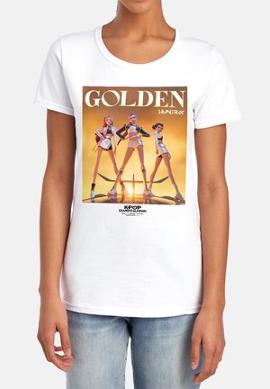Three stylized female characters in shorts and boots stand confidently against a golden sunset with "GOLDEN" and "K-POP DEMON HUNTERS" text.