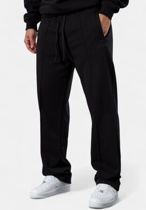 ESSENTIAL  - Tracksuit bottoms - black