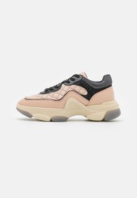 Sneaker featuring a quilted pink leather upper, black mesh accents, and a chunky beige sole with gray sections, designed for comfort.