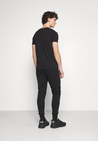 Alpha Industries BASIC - Jogginghose - black