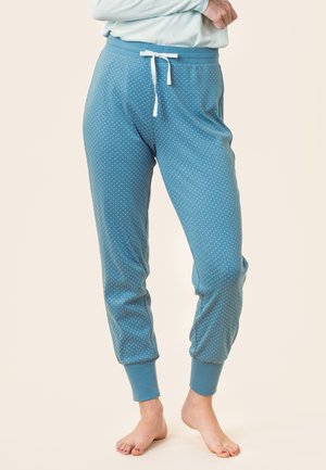 Türkise Schlafanzughosen mit weißen Punkten, mit elastischen Bündchen an den Knöcheln und einem elastischen Bund. Sie verfügen über eine Kordelzug für eine verstellbare Passform.