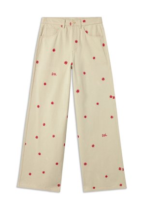 Pantalons larges beiges en coton avec broderie florale rouge et le mot "SOL" en rouge. Comprend des poches latérales et une fermeture à bouton.
