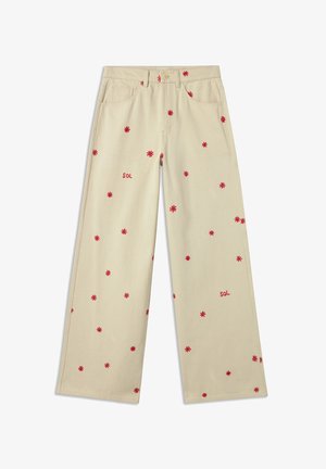Pantaloni larghi beige in cotone con ricami floreali rossi e la parola "SOL" in rosso. Presentano tasche frontali e chiusura con bottone.