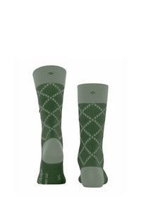 Zielone skarpetki w diamentowy wzór, z teksturowaną środkową częścią oraz jednolitym kolorem na górze i pięcie. Materiał mieszanki bawełnianej.
