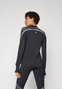 ASICS LIMITED SERIES LITE-SHOW TOP - Tops ar garām piedurknēm - performance black