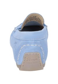 Light blue suede slip-on shoe with a rounded back, white stitching, textured sides, and a molded tan rubber sole featuring the brand logo.