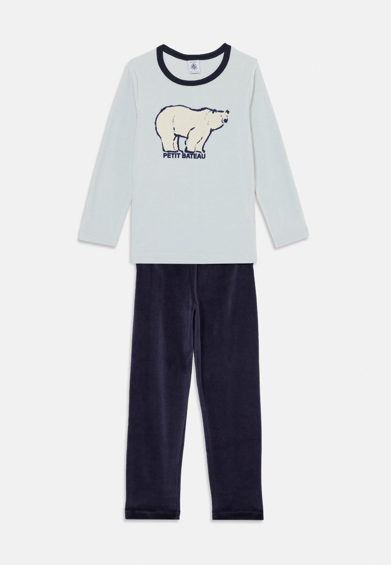 Light blue long-sleeve top featuring a bear graphic and "Petit Bateau" text, paired with soft navy blue pants. Both made of comfortable fabric.