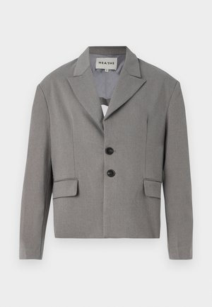 Gray cropped blazer made of textured fabric, featuring a notched collar, two black buttons, and two front pockets.