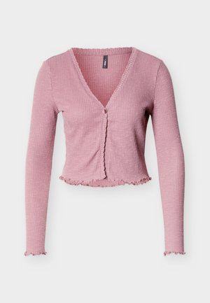 Pink ribbed cardigan with a V-neck, long sleeves, and decorative scalloped edges. Features a single button closure at the front.