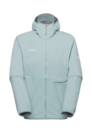 Lyseblå hættetrøje med lynlås foran, brystlomme på venstre side, elastiske manchetter og "MAMMUT"-logo på brystet og ærmet.