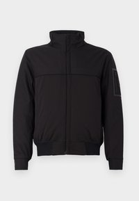 Black jacket with a high collar, contrasting upper panel, elastic cuffs and hem, and a zippered pocket on the sleeve. Smooth fabric texture.