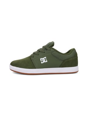 Green suede sneakers with white rubber sole, lace-up design, padded collar, and DC logo on the lateral side.