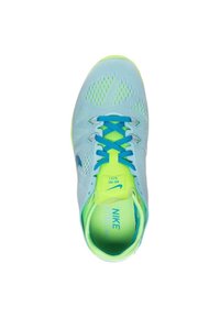 Light blue athletic shoe with mesh upper, teal accents, and neon green highlights. Features blue laces and cushioned insole.