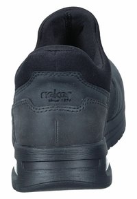 Black athletic shoe with a smooth leather and fabric upper, padded collar, and a textured rubber sole. Features logo on the heel.
