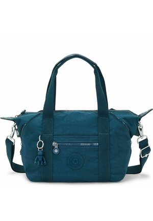 Sac à main en tissu bleu sarcelle avec deux poignées, bandoulière ajustable, poche avant zippée et un petit porte-clés singe attaché à la poignée.