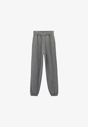 Graue Sweatpants mit einem elastischen Bund, zwei seitlichen Taschen und einem eng anliegenden Bund am Knöchel. Hergestellt aus weichem, strukturiertem Stoff.